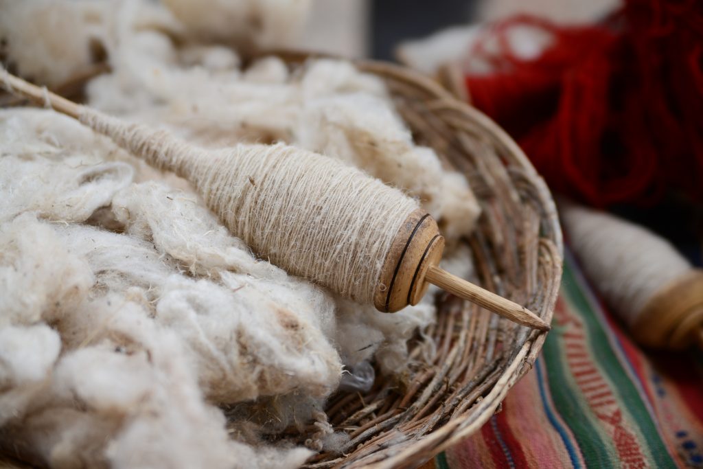 alpaca wool peru credit shutterstock>
<figcaption>
alpaca wool peru credit shutterstock
</figcaption>
</figure>
<h2>
Cusco – the textile capital of Peru
</h2>
<p>
Renowned for being home to some of the best textile artisans in all of South America, Cusco is the heart and soul of Peru’s textile industry although the sheer concentration of low and mid-range market stalls and shops means you’ll need to know where to go to find exceptional, authentic, 100% alpaca wool garments.
</p>
<p>
Cusco is the best and most obvious shopping destinations in Peru, considering this is the base town for visits to Machu Picchu, the #1 “must-see” of just about every visitor to the country.
</p>
<p>
Many prized indigenous weavers around Cusco make fantastic and high-quality garments and are sold in the town’s more upmarket boutiques. Visit the <a href= alpaca wool peru credit shutterstock