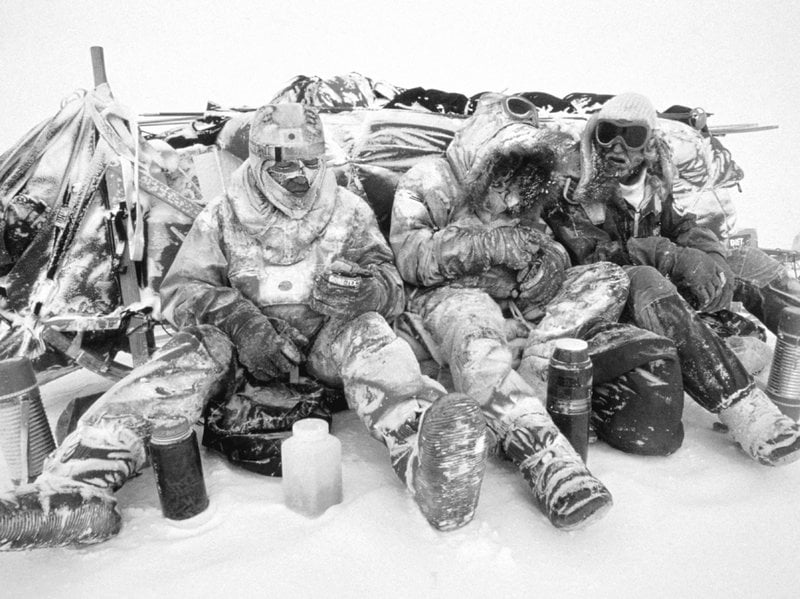 Polar explorers having a meal Polar explorers having a meal
