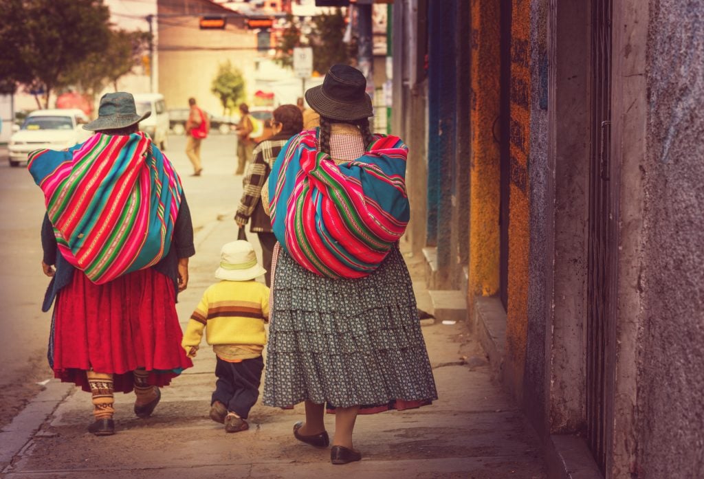 women walking in La Paz, Bolivia women walking in La Paz, Bolivia