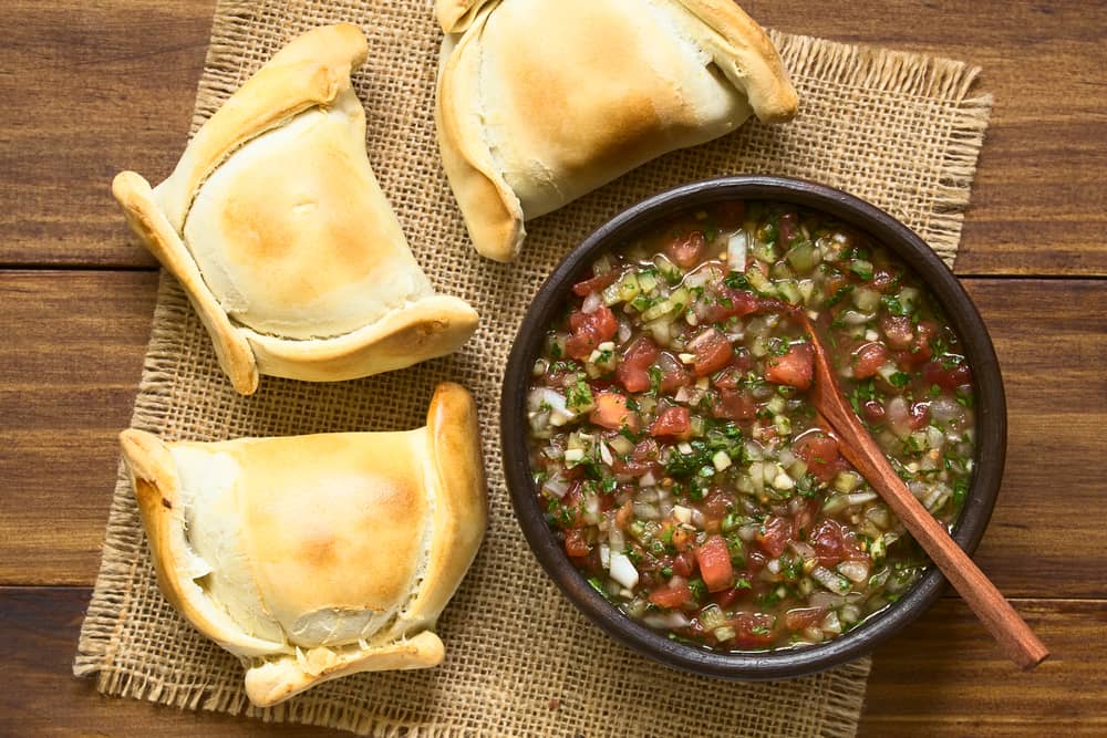 Chilean empanadas with a traditional Chilean Pebre sauc Chilean empanadas with a traditional Chilean Pebre sauc