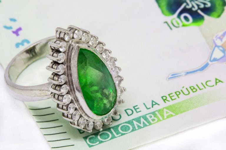 Colombian Emerald Ring and 2016 issued bills credit shutterstock Colombian Emerald Ring and 2016 issued bills credit shutterstock