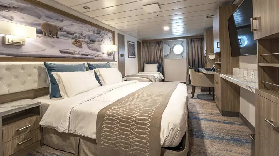 Triple Stateroom Interior of a Triple Stateroom on Greg Mortimer