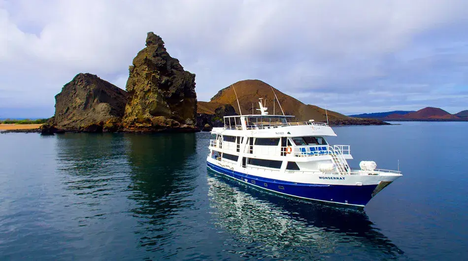 Monserrat Galapagos Cruise Ship infront of Pinacle Rock Monserrat Galapagos Cruise Ship infront of Pinacle Rock